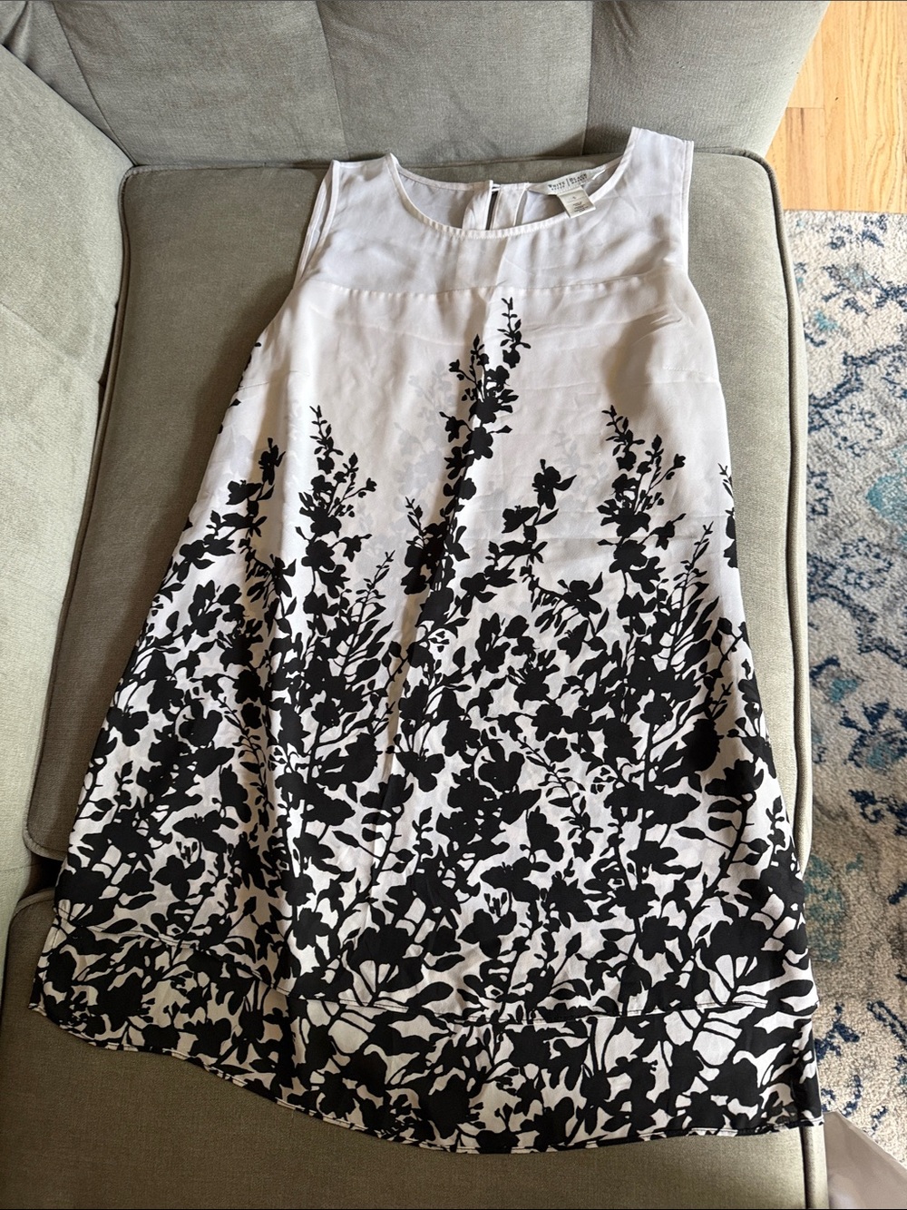 White House Black Market sleeveless, sheer top with unique black floral pattern